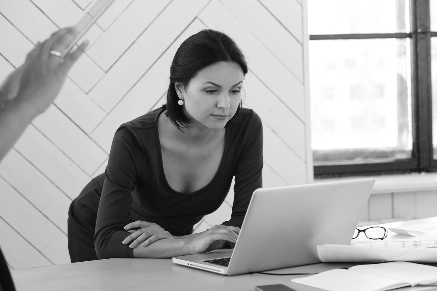 Financial documents and analysis tools on a professional workspace